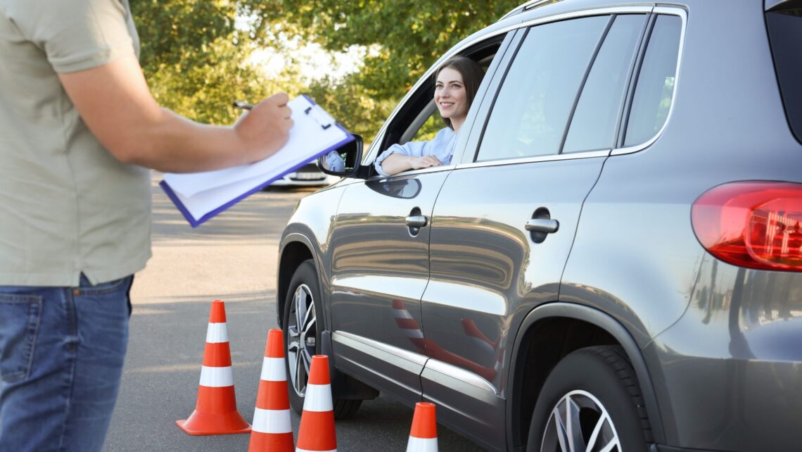 orange cones women in car driving school