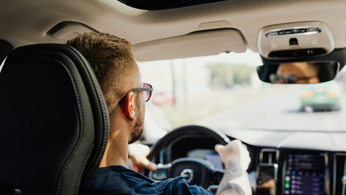 person driving car for defensive driving test